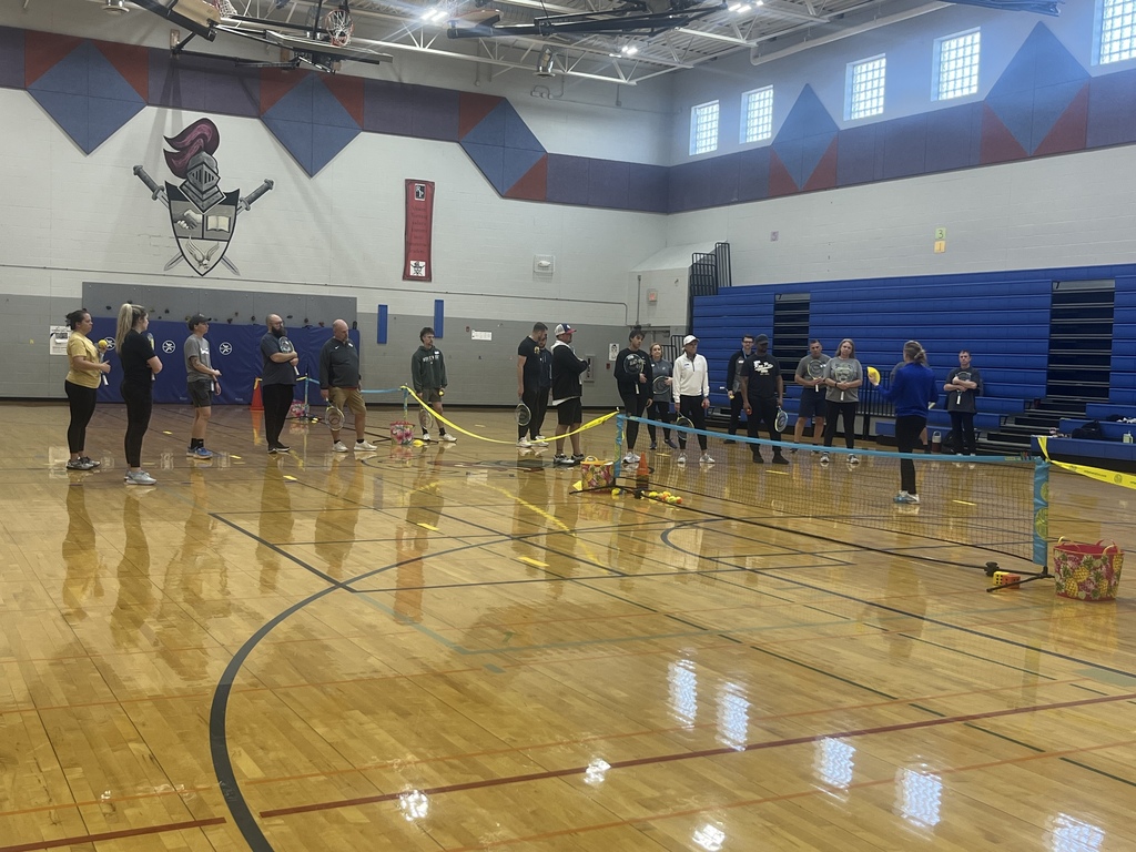 PE Teachers learning tennis instruction from USTA