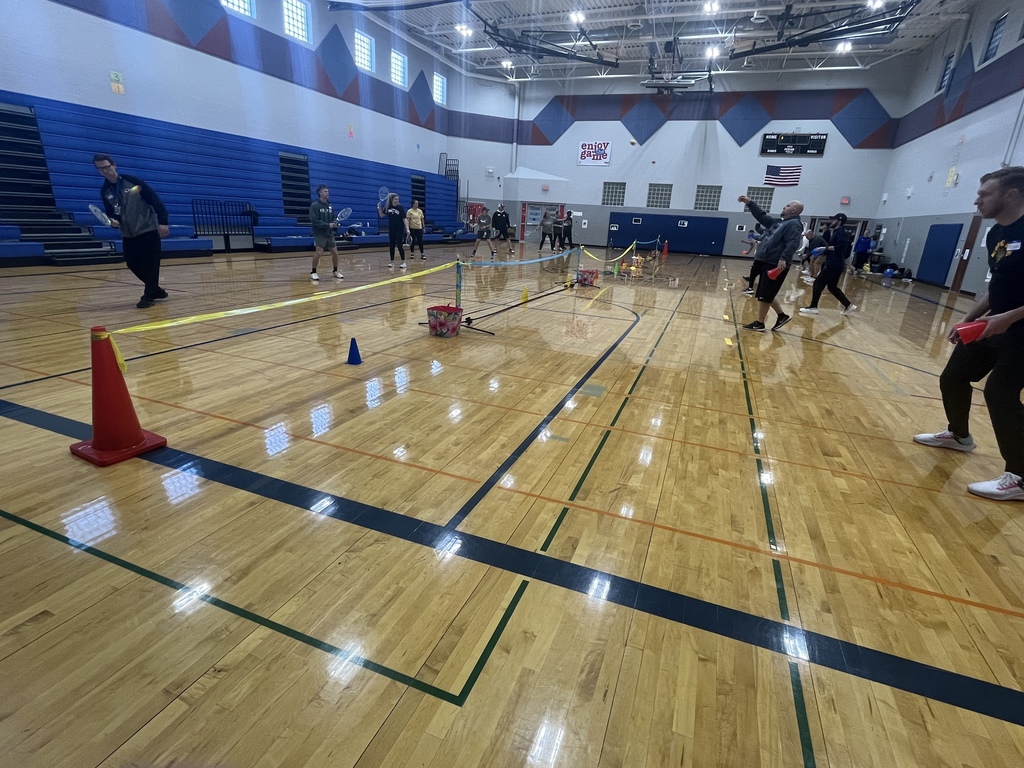 PE Teachers learning tennis instruction from USTA