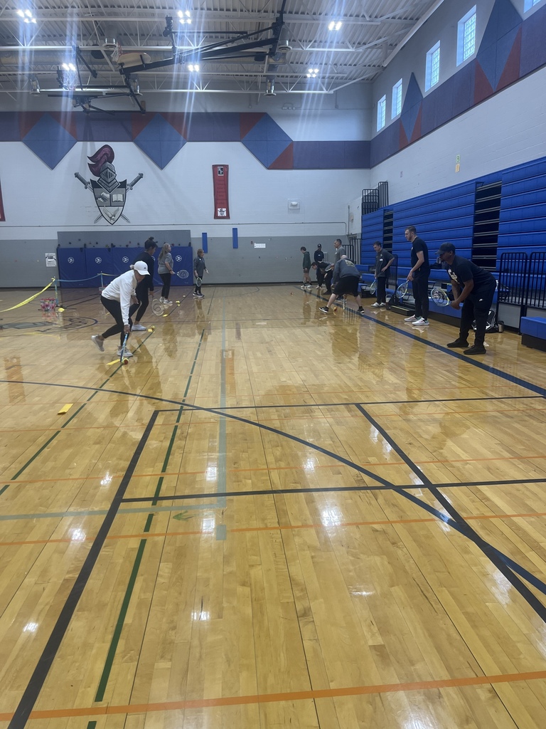 PE Teachers learning tennis instruction from USTA
