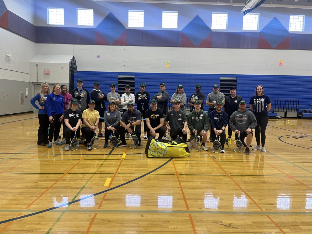 PE Teachers learning tennis instruction from USTA