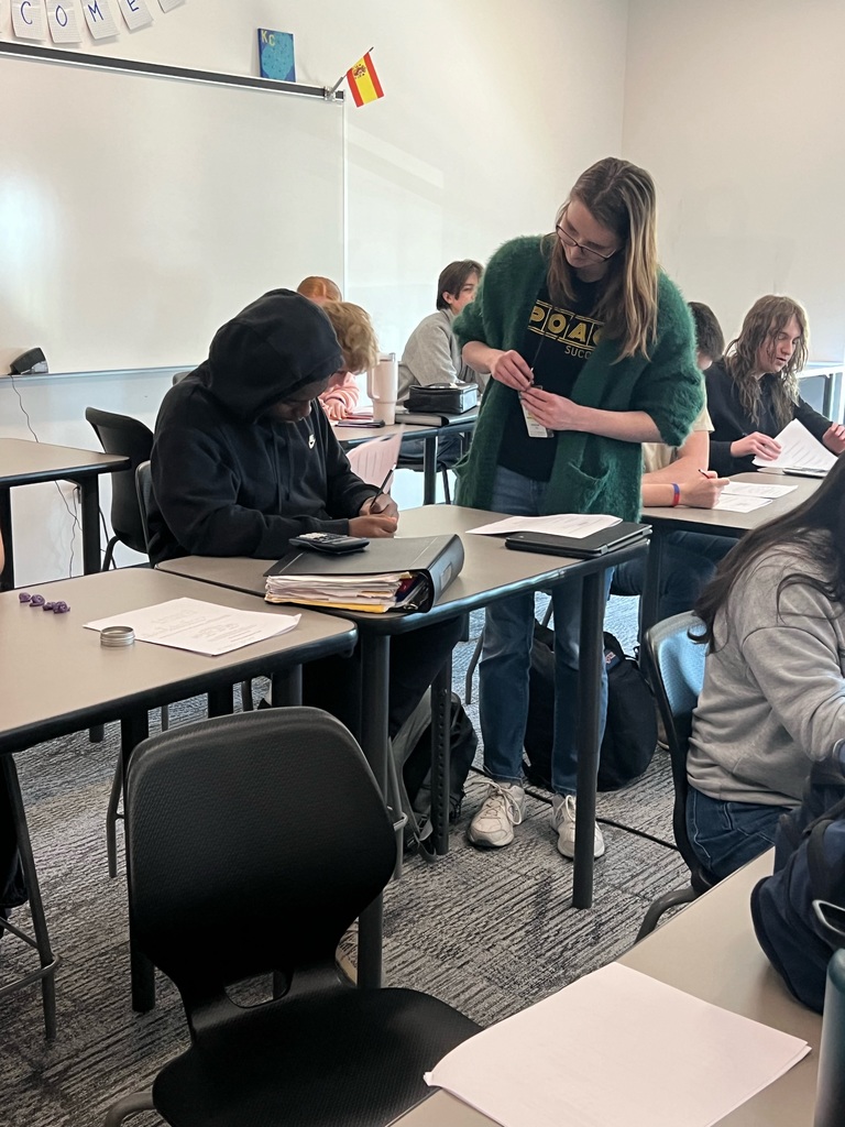 tutoring student helping a younger student