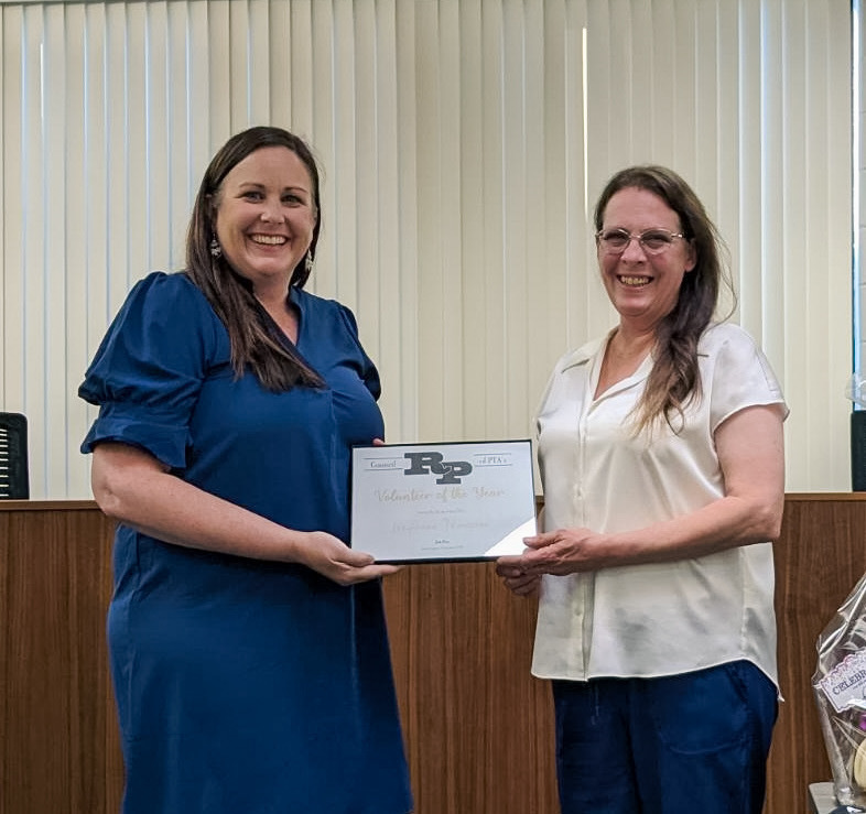 Jodi Price, PTA Council President, congratulates LeeAnne Thompson