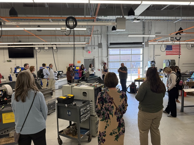 Educational leaders tour the machinery department of the LEAD Center