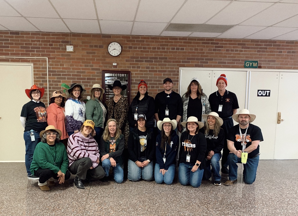 Group of men and women wearing hats in support of hat day for the homeless