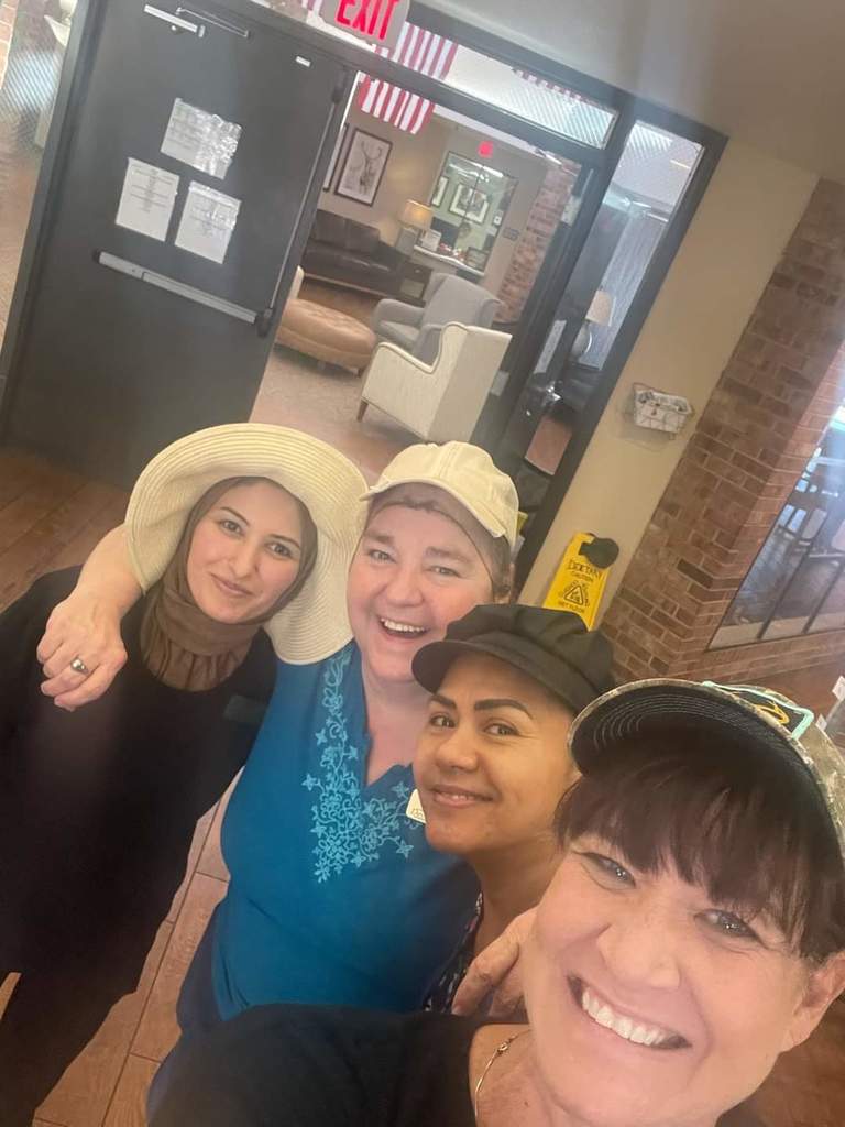 community members wearing hats
