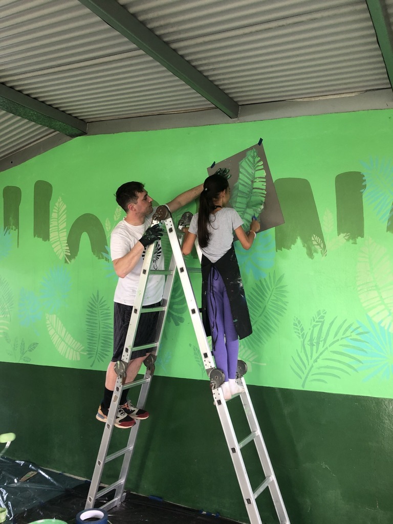 Putting up the mural