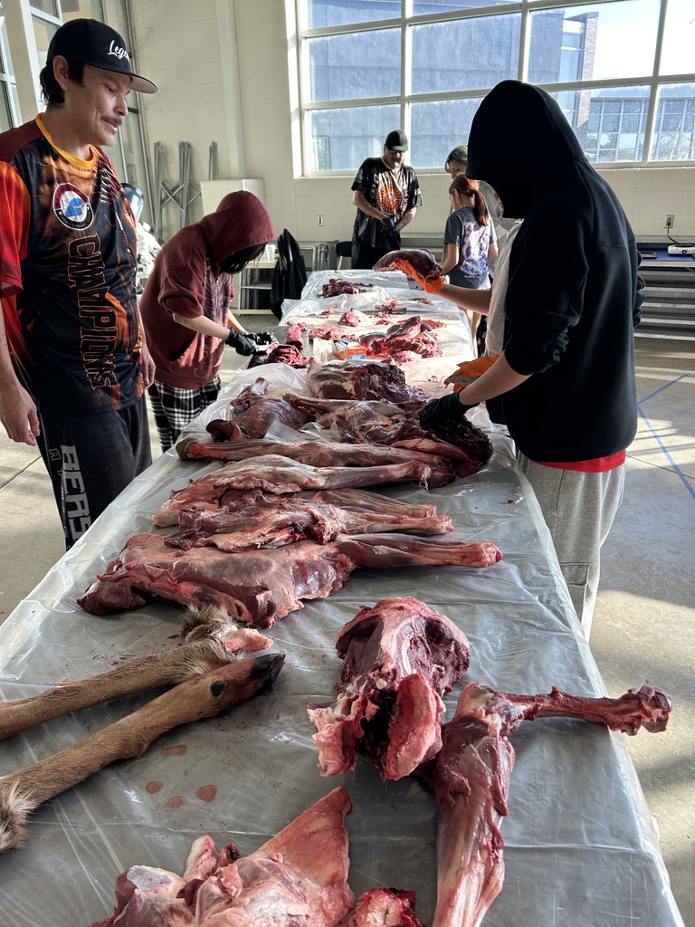 From field to feast! Students learned to process deer with Rob May, Ty Stately, and Daris Rosebear—then cooked and enjoyed their hard-earned meal.