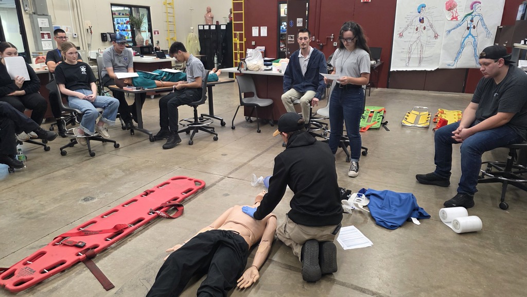 Former EMS students helping with skills