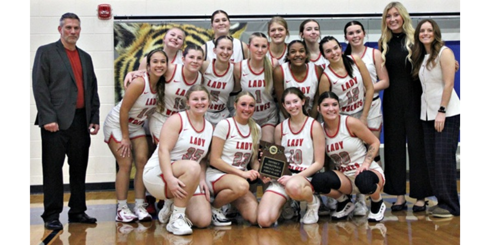 team holding plaque