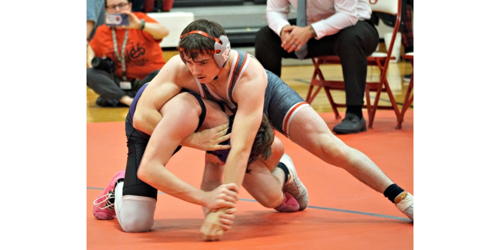 wrestler putting half nelson on opponent