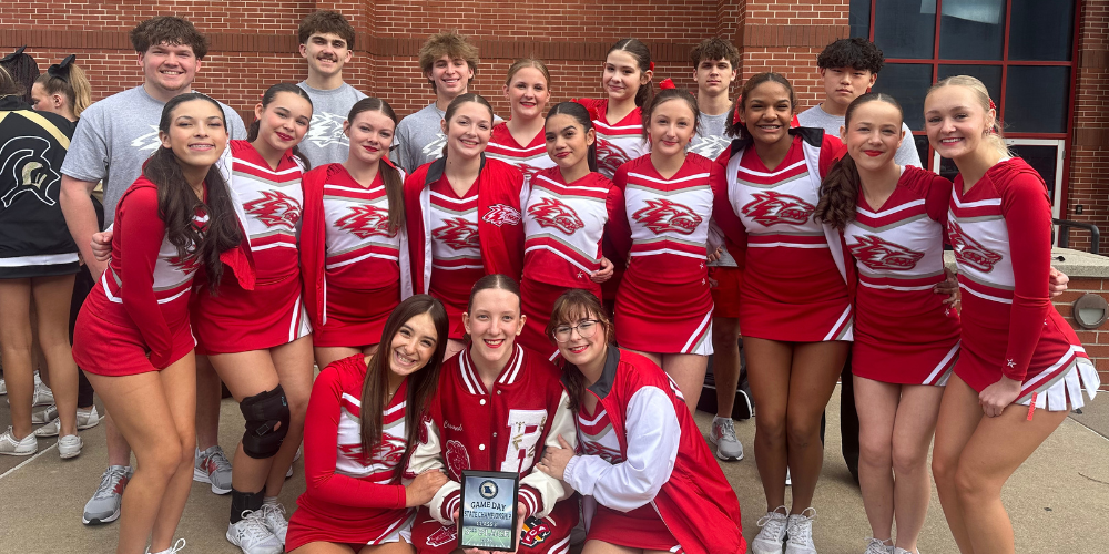 cheer team holding plaque