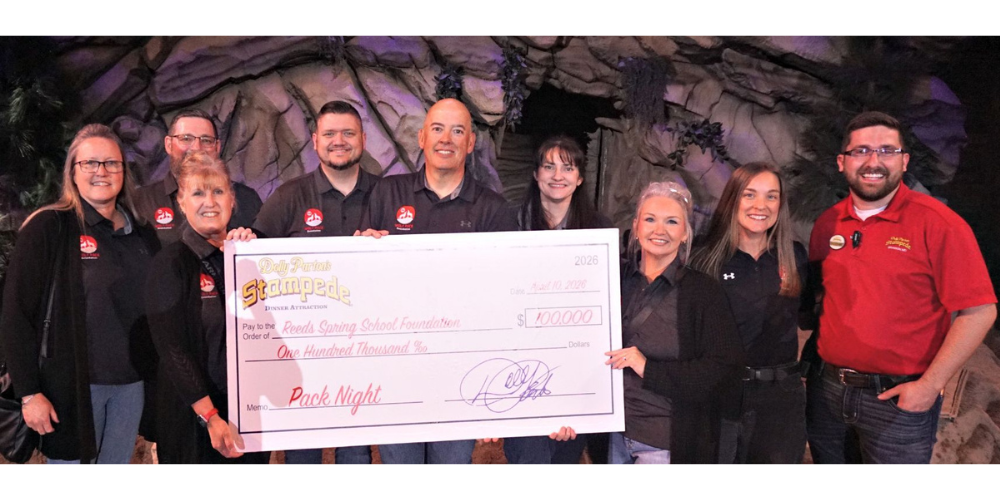 group photo of Wolf Pack Foundation with big check