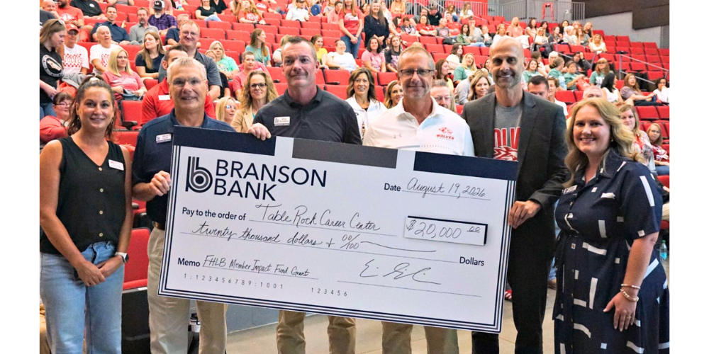 Branson Bank employees present check to TRCC employees