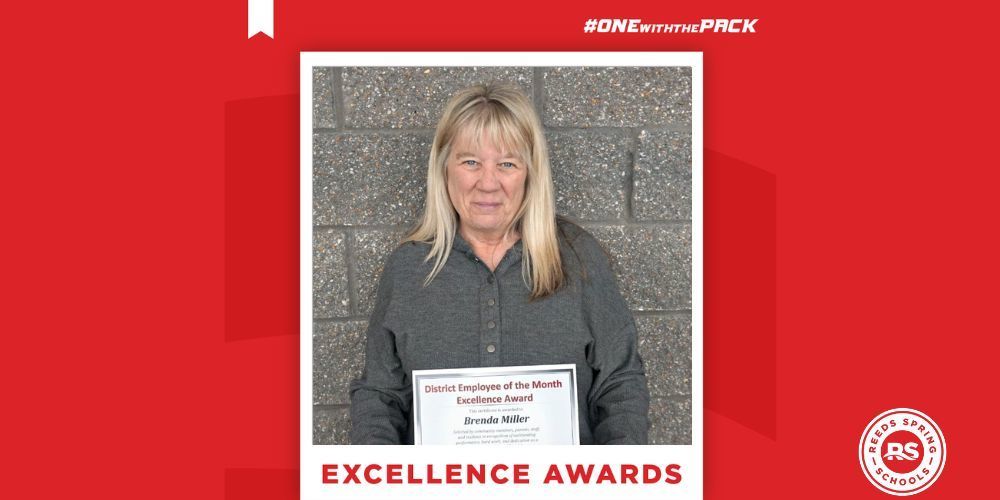 woman with blond hair and gray shirt holding a certificate