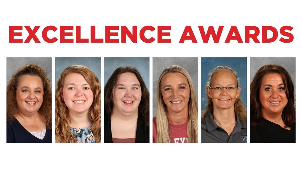 six employees smiling at camera