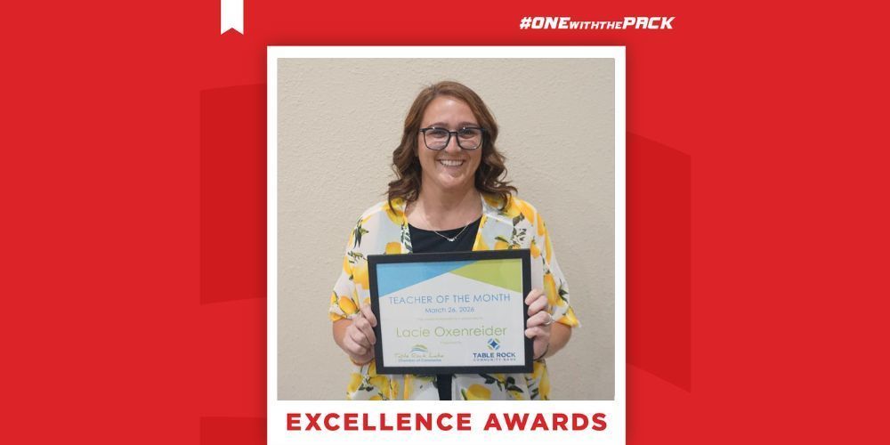 Lacie Oxenreider holding a certificate