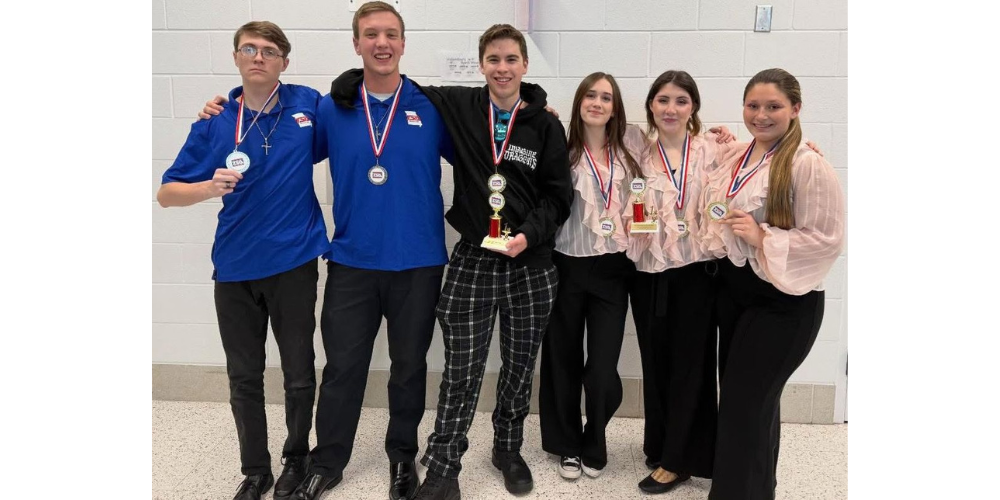 6 students wearing medals around necks