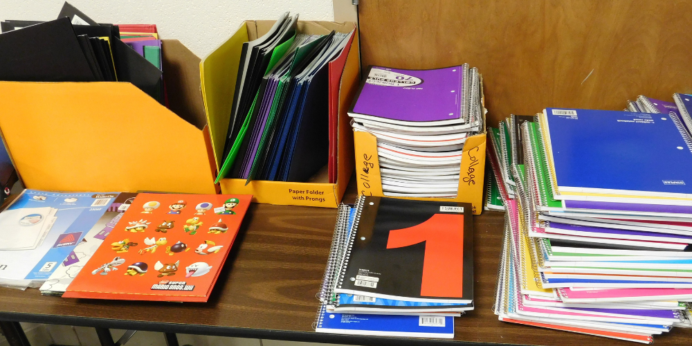 table full of notebooks