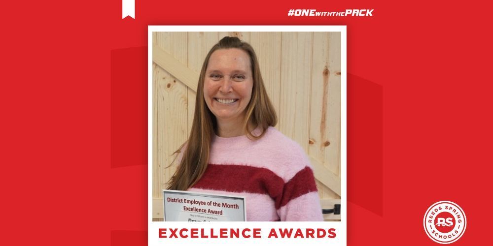 woman in sweater holding certificate