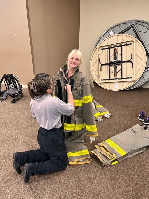 girl puttin g on gear