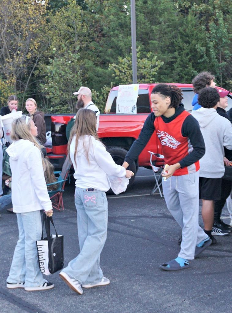 basketball player handing out candy
