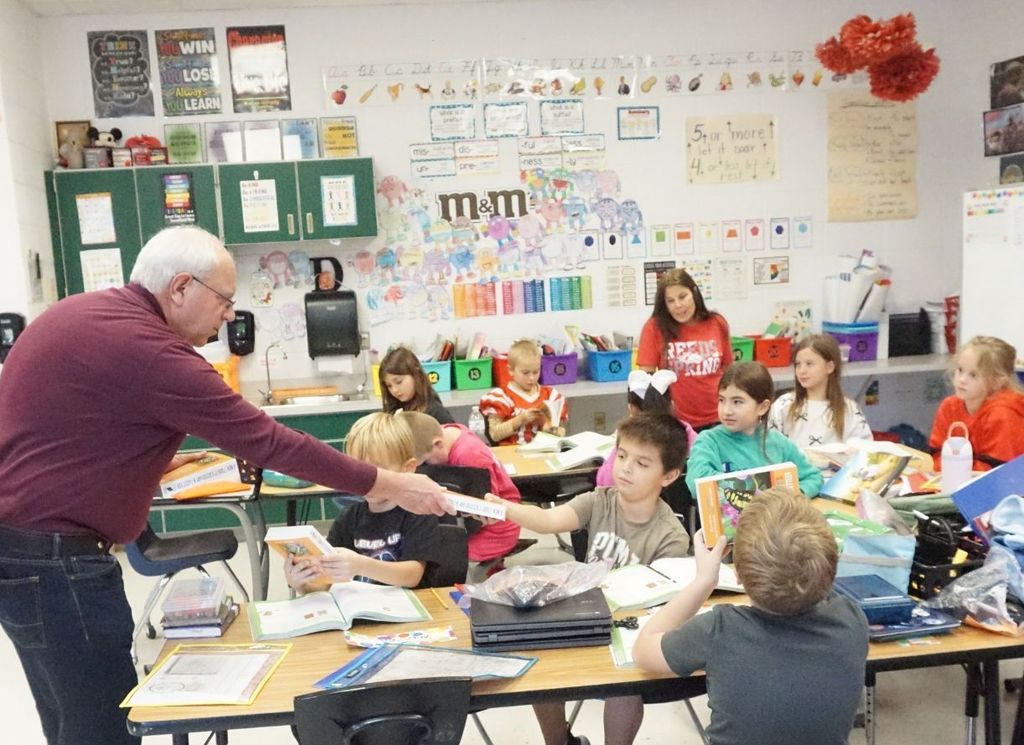jim handing out book