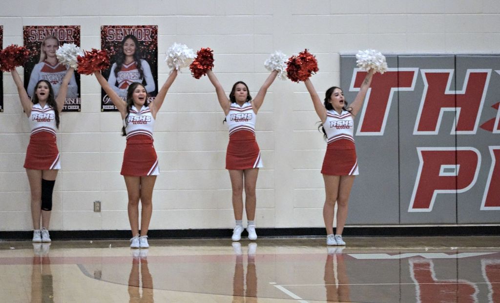 cheerleaders with arms up