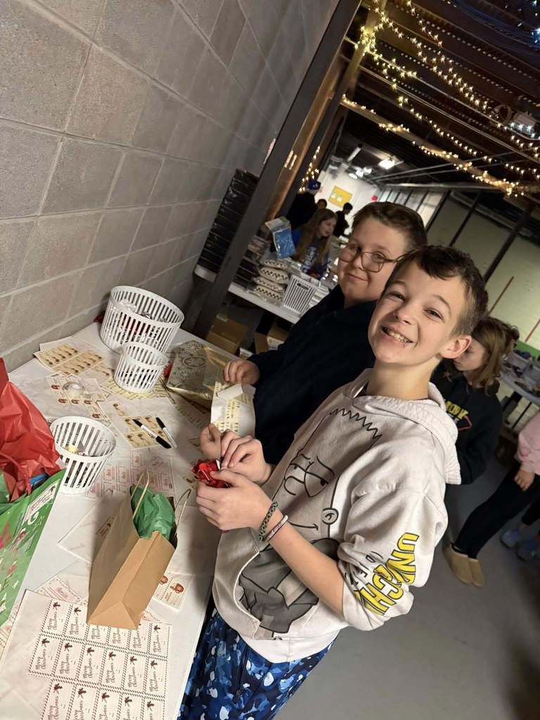 students putting tags on presents