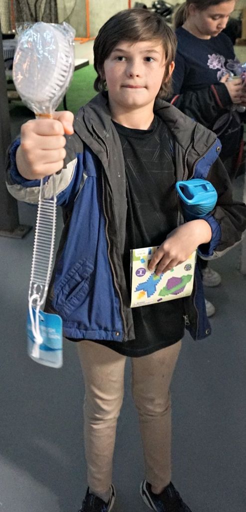 student holding brush