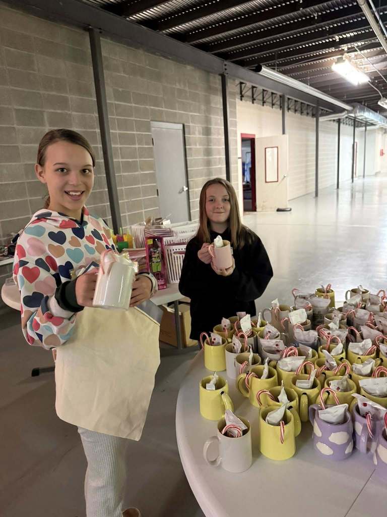 students holding gifts