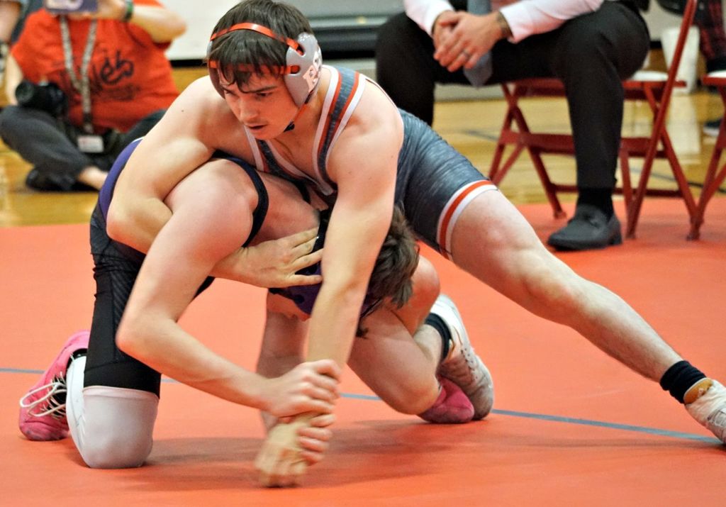 wrestler putting hold on opponent