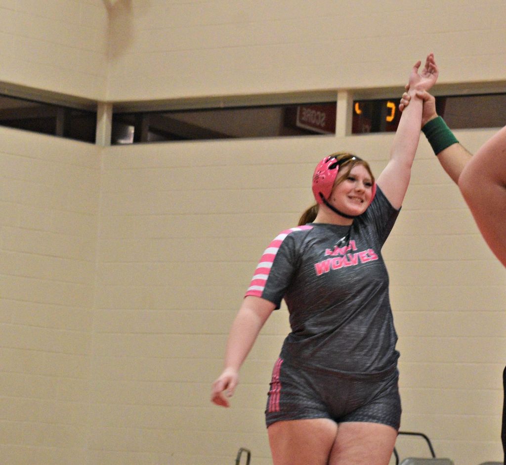 arm raised in victory