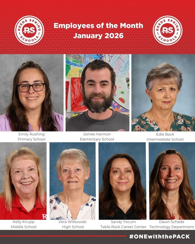 7 employees smiling at camera