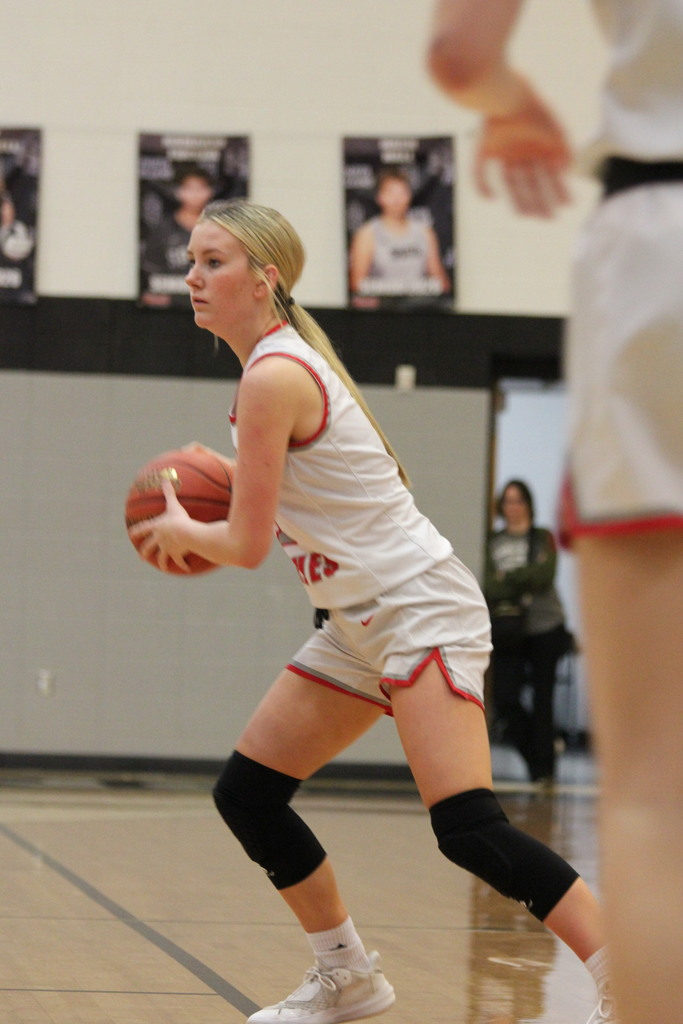 player in white looking to pass