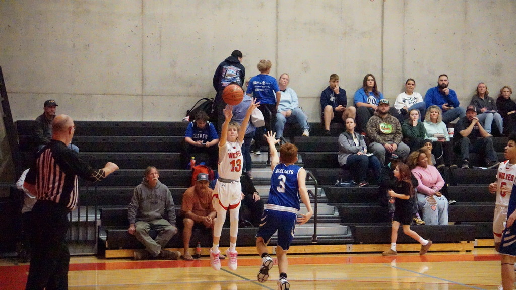 #13 shooting a 3 pointer