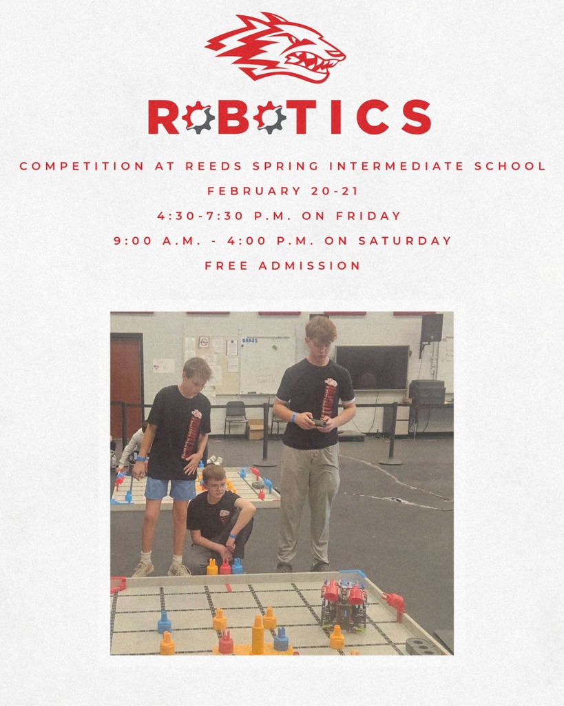 3 students controlling robot with remote control