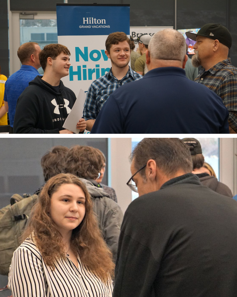 students talking to employers at booths