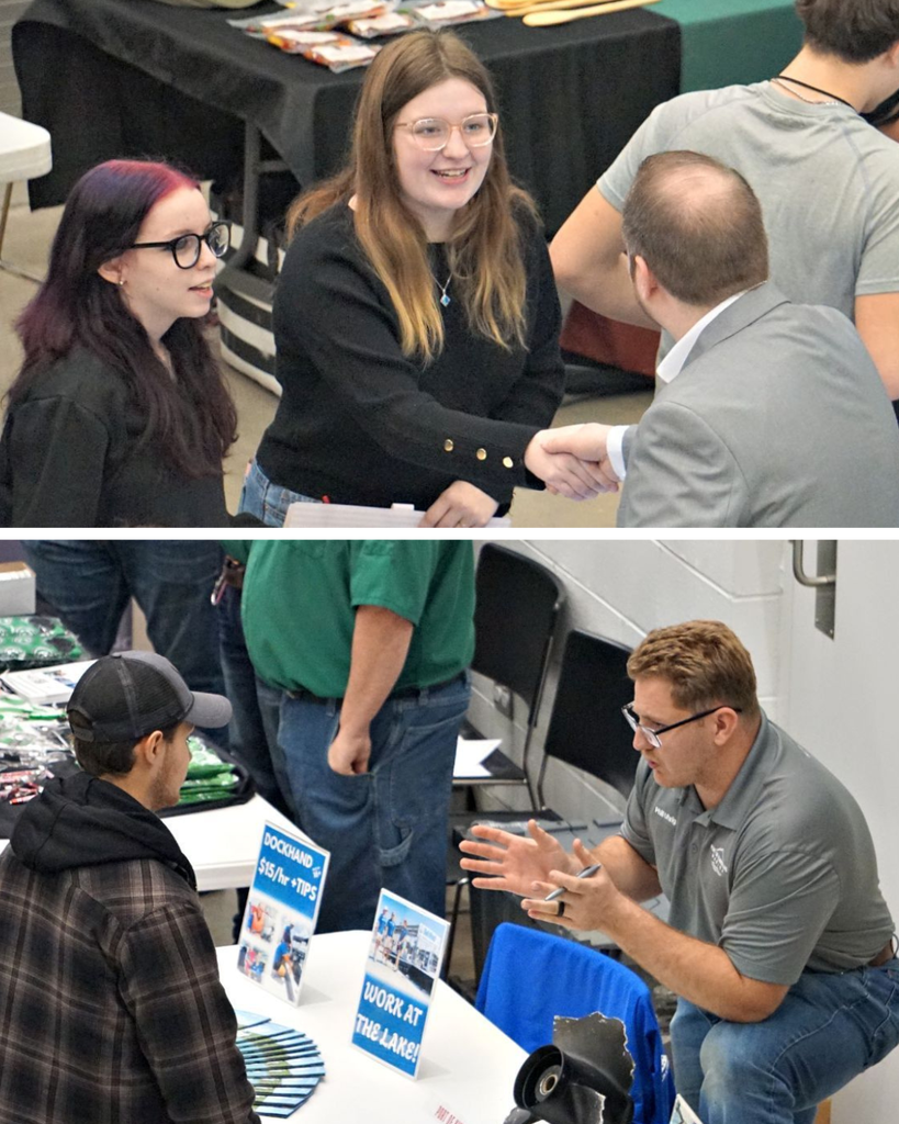 students talking to employers at booths