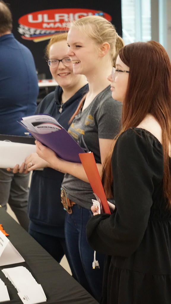 students talking to employers at booths