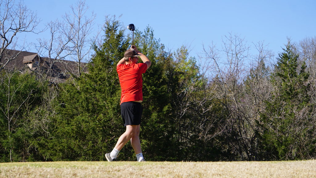 Evan Metcalfe watches tee shot