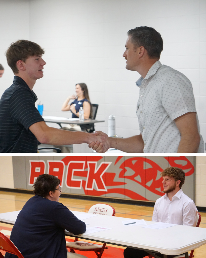 student shakes hand with adult