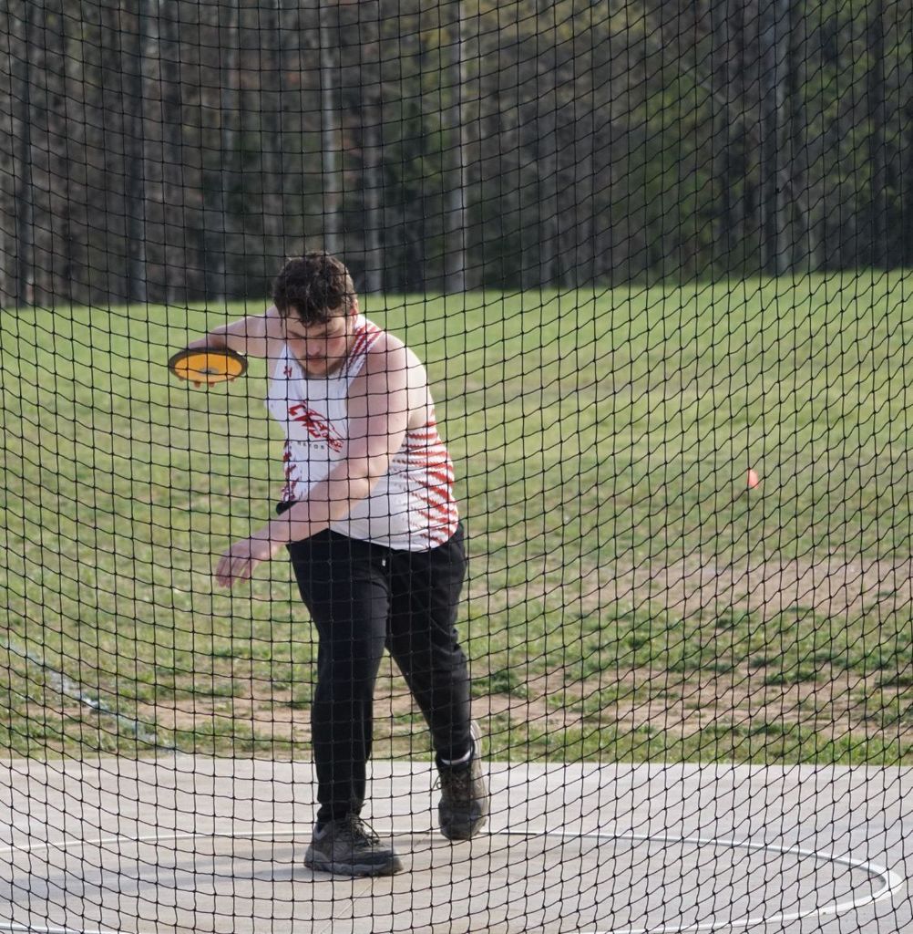 boy throwing discus