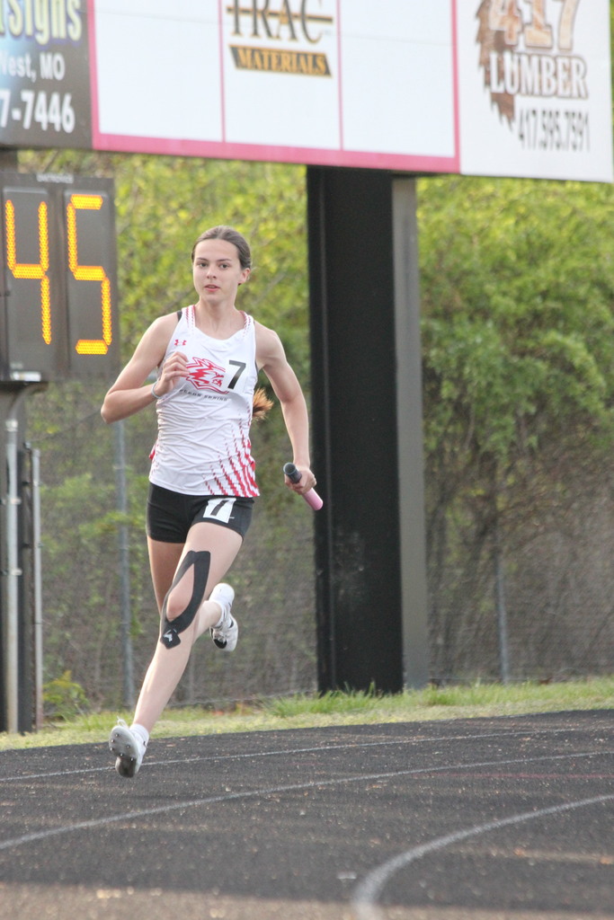 Josephine Buxton running with baton