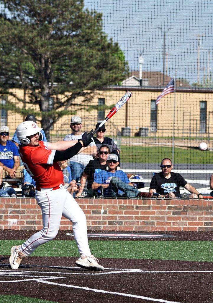 batter following through on swing