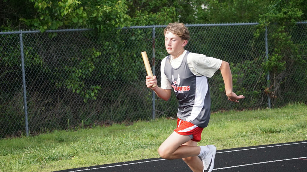 boy running with baton