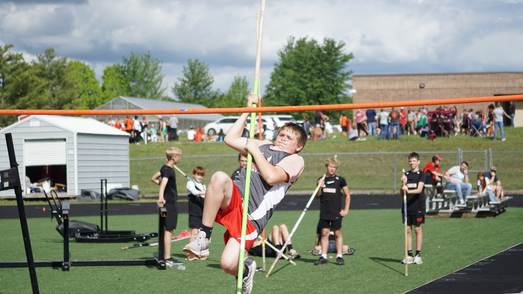boy pole vaulting