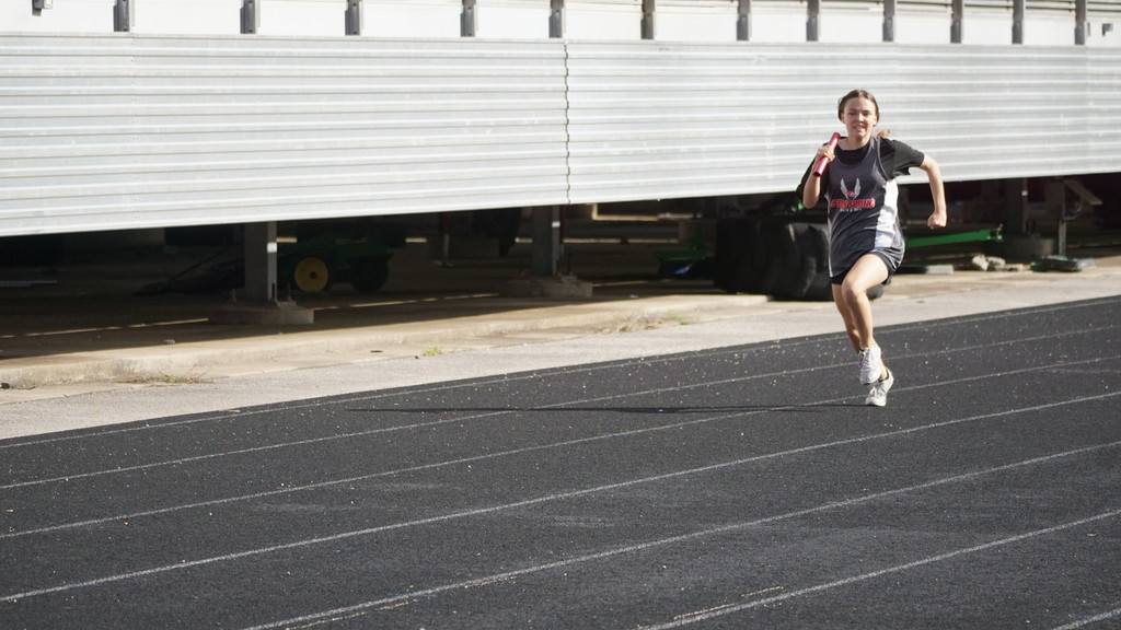 girl running with baton