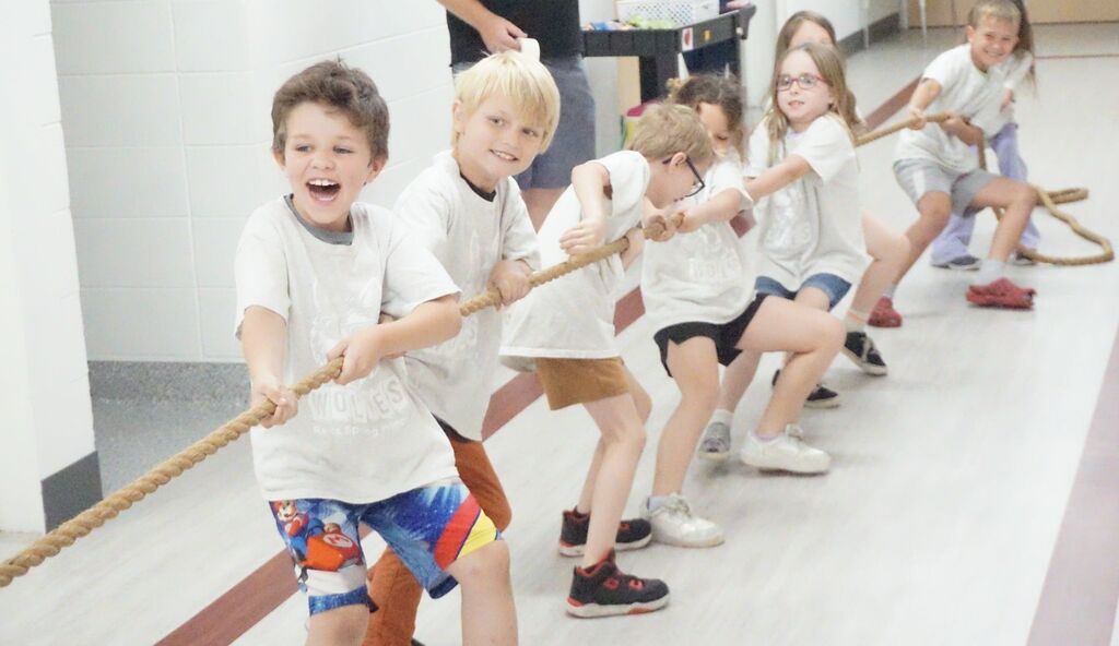 class playing tug of war