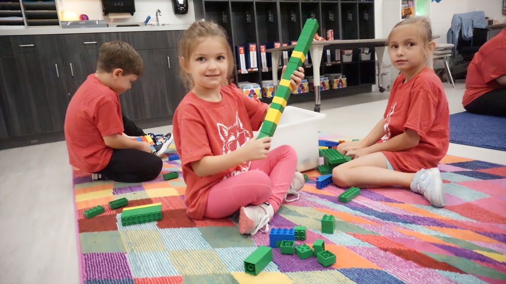 girl building with legos