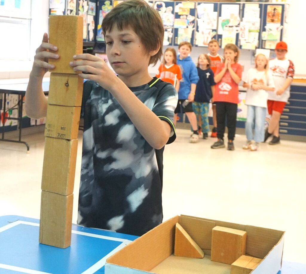 boy stacking blocks